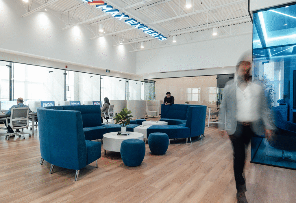 Training room designed with commercial furniture office tables and stackable seating for real estate professionals