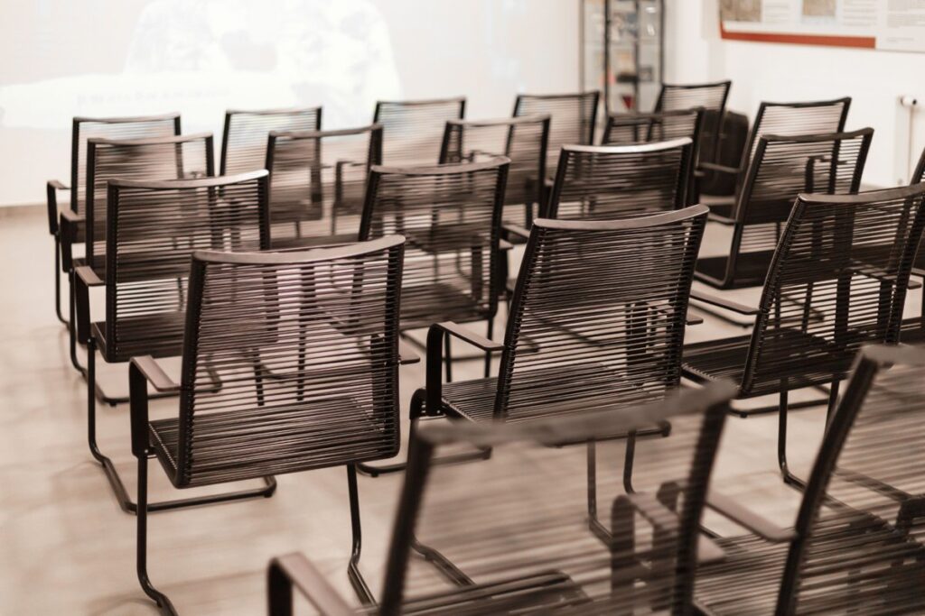 Modern stackable chairs in a healthcare facility, showing durable and adaptable furniture solutions for Canadian clinics.