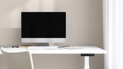 height-adjustable smart desk with integrated technology in a Canadian office workspace