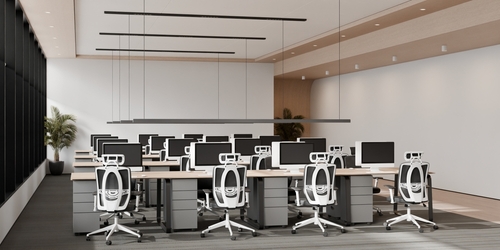 Contemporary open office in Kitchener-Waterloo featuring ergonomic white chairs, modern desks, and collaborative workstations, a showcase of premium office furniture Kitchener-Waterloo businesses use to enhance productivity and comfort.