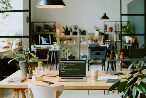Smart office furniture in a modern Canadian workspace with ergonomic design and natural elements