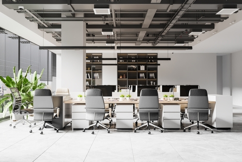 Modern open-plan office in Ottawa with ergonomic chairs, shared desks, and natural lighting, showcasing stylish office furniture Ottawa businesses use to create productive, inspiring workspaces.