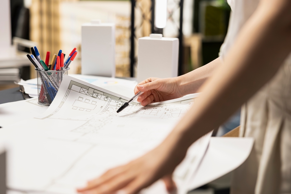 The Office Shop reviewing office floor plan drawings and workspace layout planning for office furniture installation and design