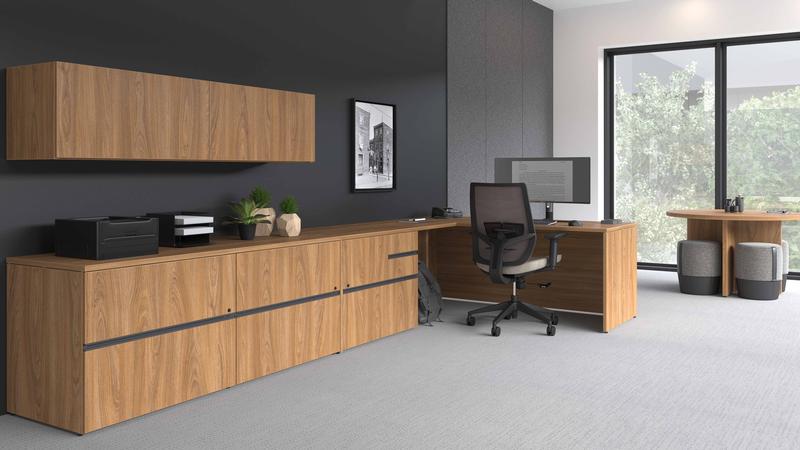 Executive L-shape desk with wall-mounted storage and ergonomic seating from The Office Shop, available through office furniture rental Toronto businesses rely on