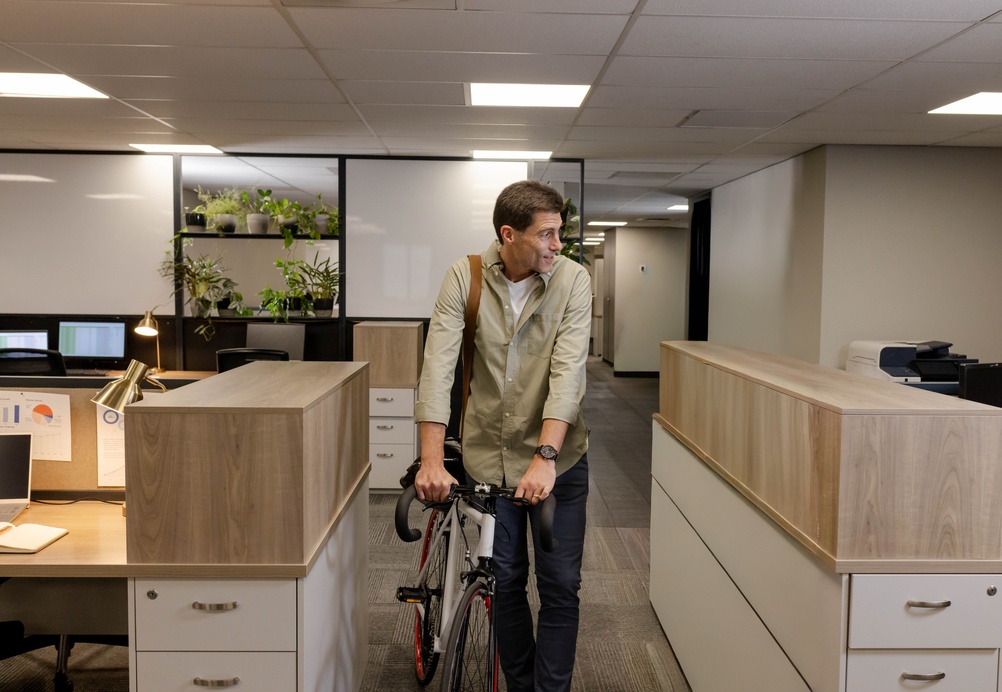 Modern office interior featuring desks, seating, and office furniture file cabinets wood designs for organized storage.

