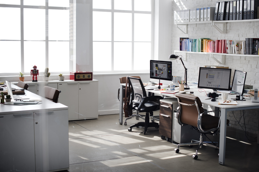 Professional workspace with contemporary furnishings and office furniture file cabinets wood units along the wall.

