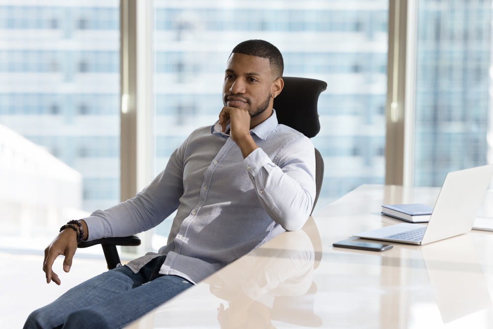 Contemporary workplace furnished with the best ergonomic office chairs to promote employee comfort and productivity.