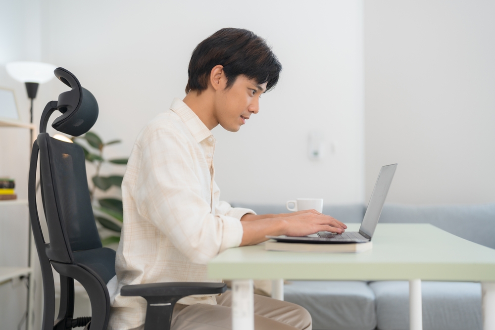 Stylish office interior displaying the best ergonomic office chairs in meeting spaces and individual workstations.