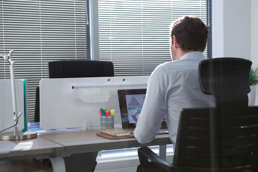 Bright corporate workspace showcasing the best ergonomic office chairs designed for comfort and long-term support.