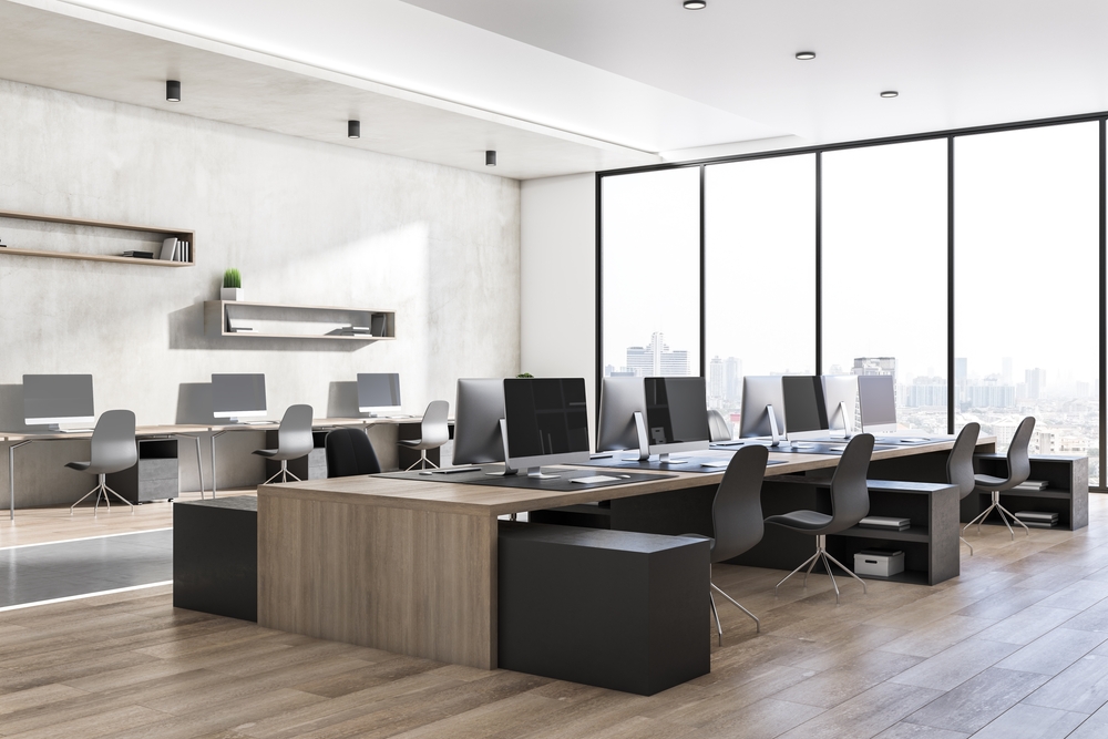 Stylish office interior displaying ergonomic office furniture with modern desks, ergonomic chairs, and organized meeting areas.