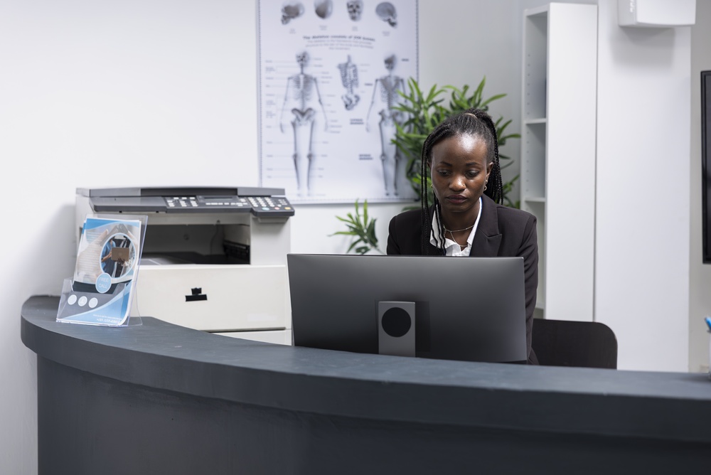 Modern office reception area featuring a stylish office reception desk with a professional layout and welcoming design.
