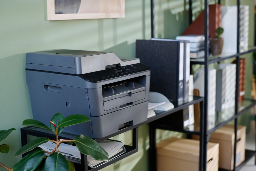 Bright corporate office featuring practical office storage solutions that combine storage cabinets, desks, and collaborative work areas.