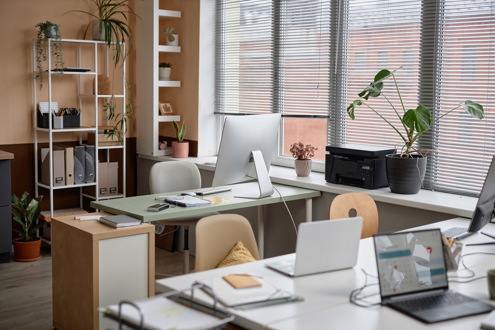 Modern office interior with ergonomic desks, chairs, and storage featured in an office furniture buying guide for workplace planning.