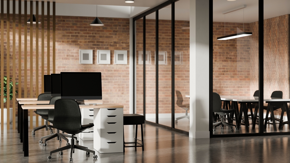 Bright corporate workspace with coordinated desks, seating, and storage highlighting choices in an office furniture buying guide.
