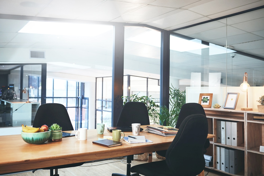 Open plan office with workstations and collaborative areas illustrating an office furniture buying guide for functional workplace design.
