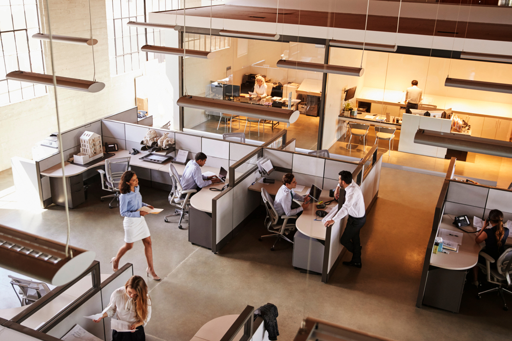 Contemporary workspace with stylish desks and seating showcasing options from an office furniture buying guide for modern businesses.
