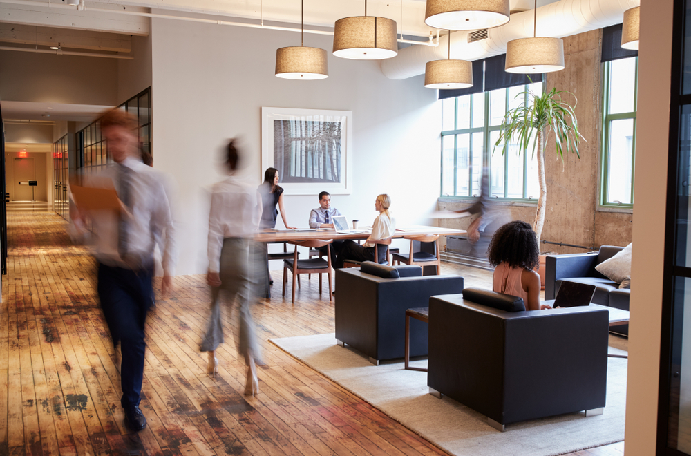 Modern office interior featuring ergonomic desks, collaborative workspaces, and commercial office furniture designed for productivity and comfort.