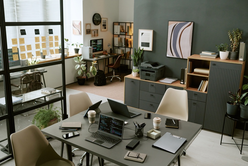 Bright open plan office with stylish commercial office furniture creating a functional and professional work environment.