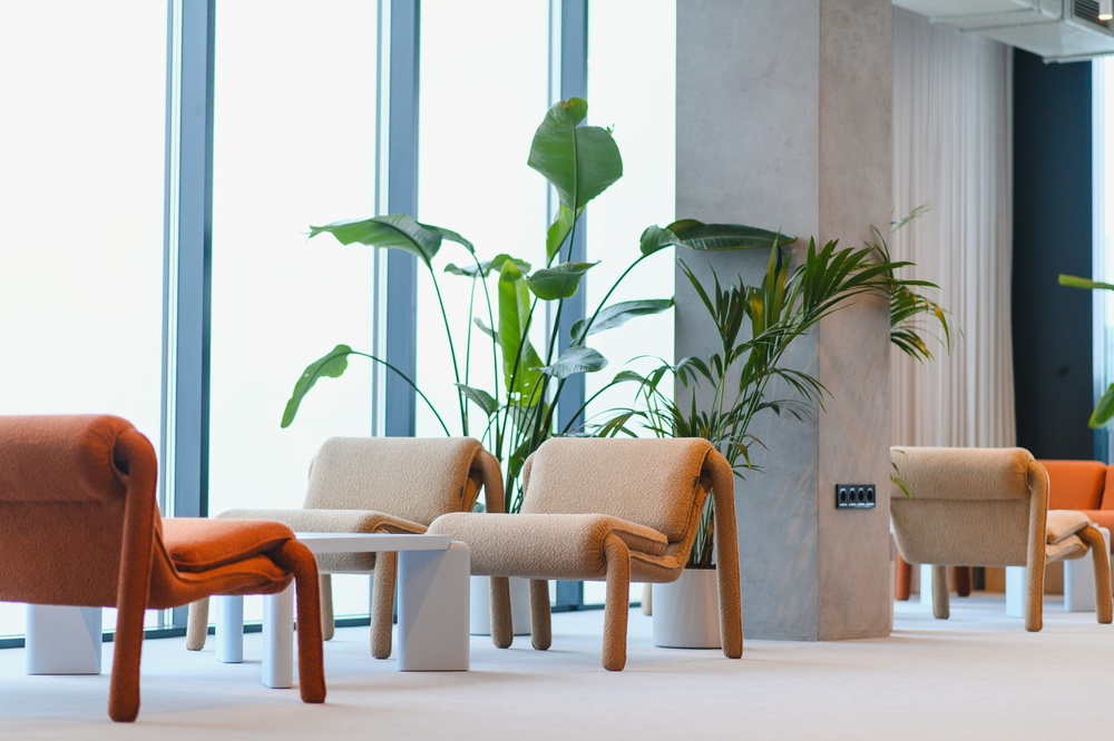 Professional office interior with coordinated commercial office furniture including ergonomic seating, workstations, and storage solutions.