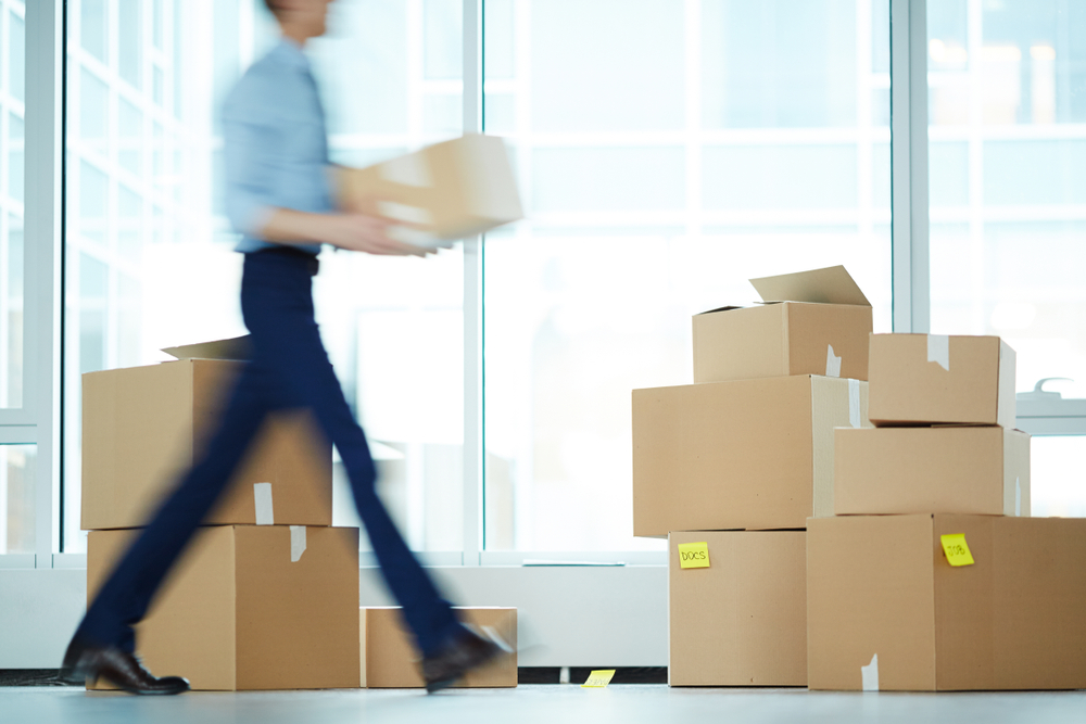 Office furniture packed up in boxes using an office relocation checklist