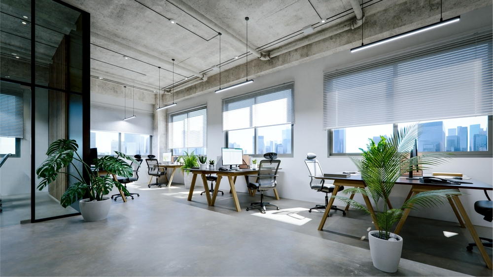Height adjustable dedicated desks used as coworking space furniture in an Ontario office