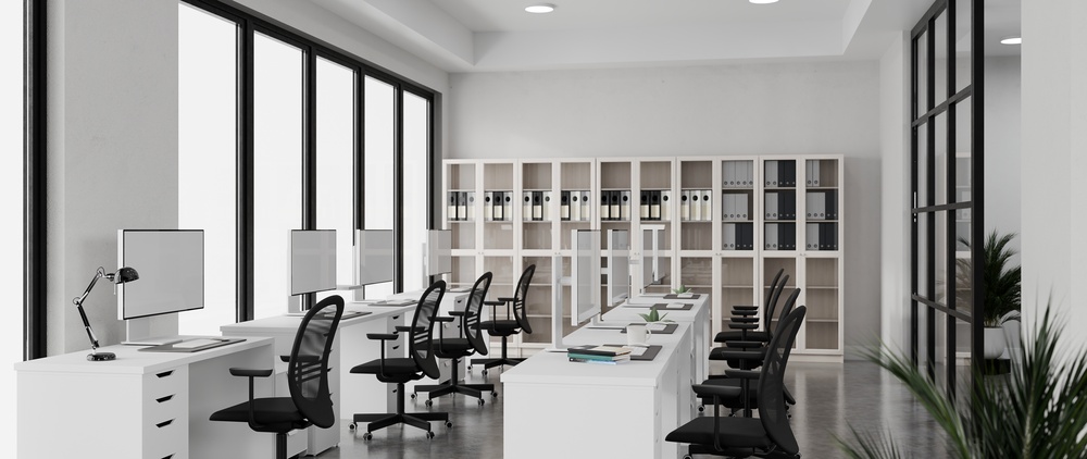 Open plan team area where each office desk with drawers has a mobile pedestal tucked beneath the worksurface