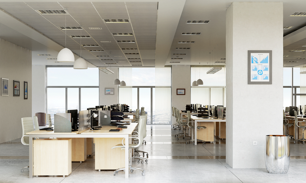 Shared workstations and low panels in an open office after office furniture reconfiguration

